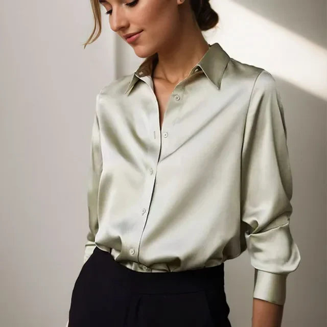 Modern women's elegant button down blouse. Chic long sleeve top, perfect for professional wear or versatile fashion.