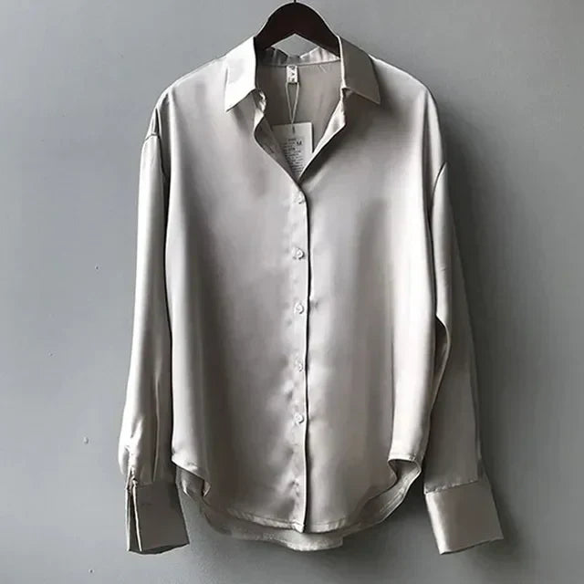 Versatile women's button down blouse. Elegant long sleeve top for professional wear, a modern and chic work blouse.