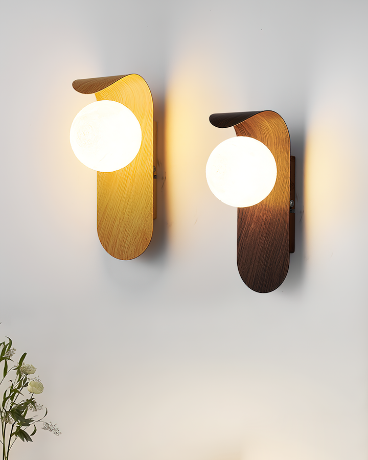 Faux wood LED wall light with an opal glass globe, creating cozy indoor atmosphere.