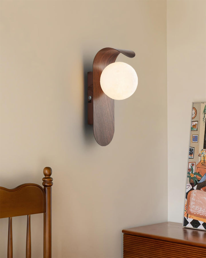 Sleek LED wall light, wood effect base, and a diffusing opal glass globe for soft light.