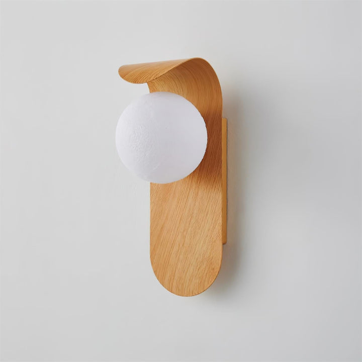 Indoor wood effect LED wall fixture, stylish opal globe, offers warm, inviting light.