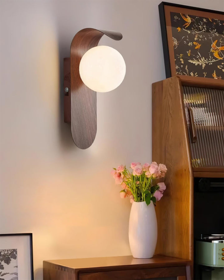 Contemporary home lighting: wood effect LED wall light with a classic opal globe.