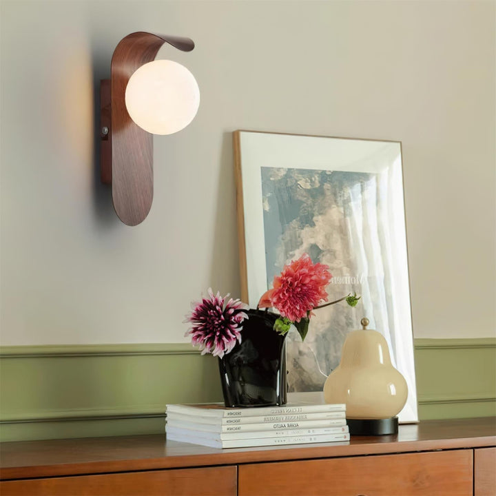 Modern wood effect LED wall light, featuring an opal glass globe for gentle illumination.
