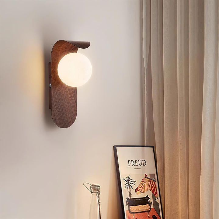 Energy-saving wood effect LED wall light with an opal glass globe for modern homes.