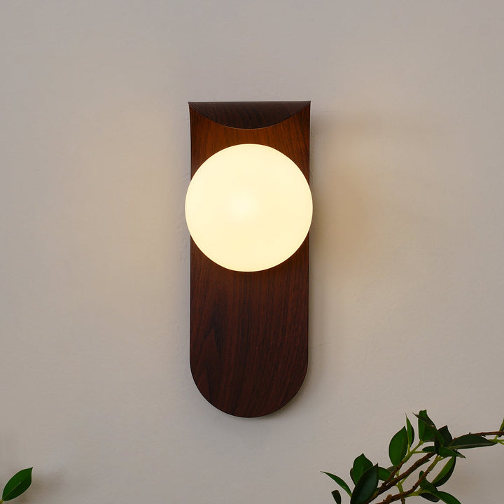 Modern LED wall light, wood effect finish, with an opal glass globe for bright, even light.