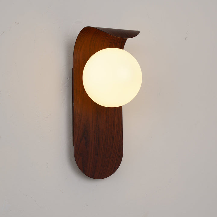 Dimmable wood effect LED wall light, opal glass globe, ideal for modern ambient lighting.