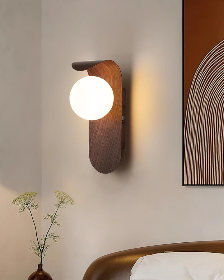 Home wood effect LED wall light, modern globe design, for subtle and efficient lighting.