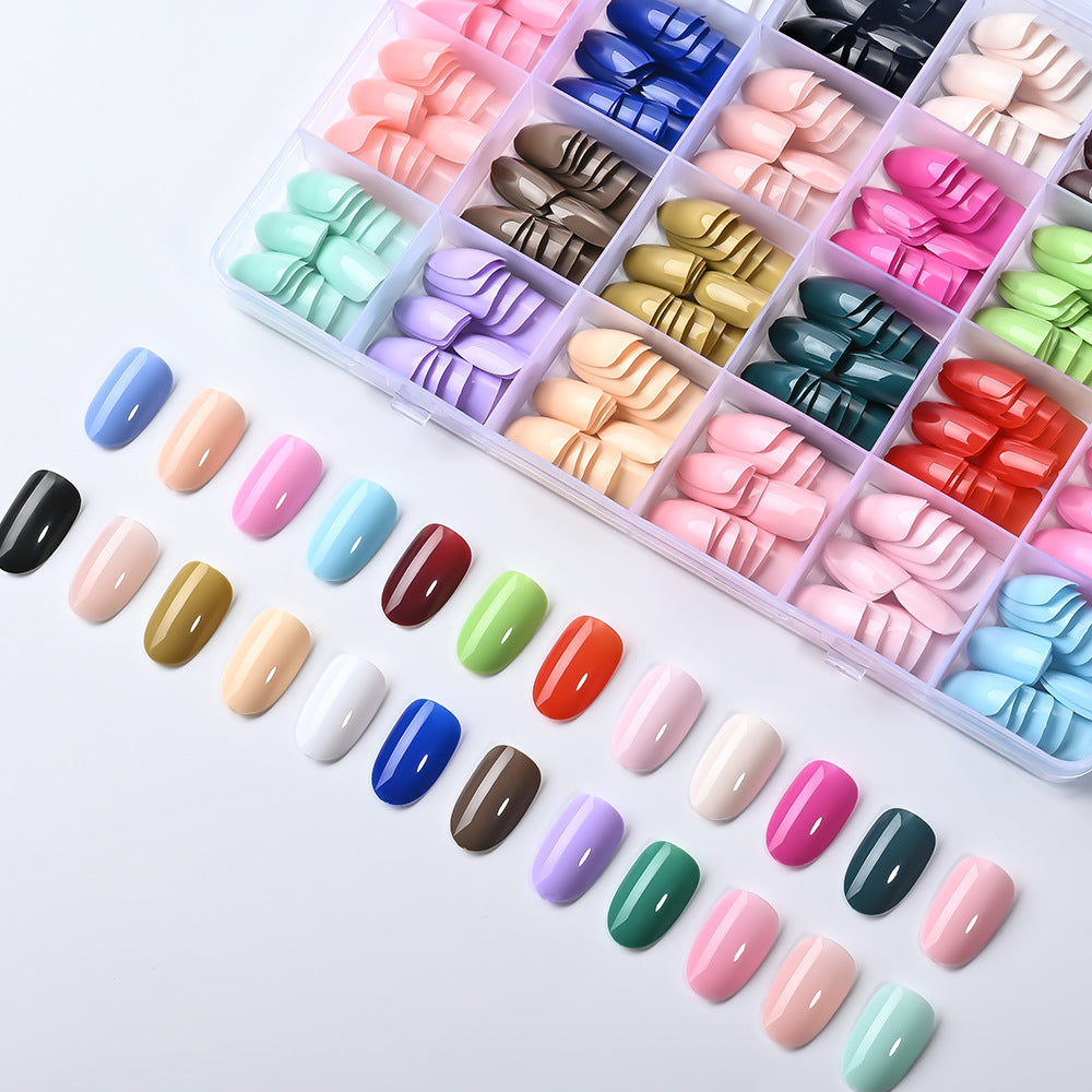 Multi-shape false nail set featuring stiletto, almond & square tips for diverse nail art & manicures.