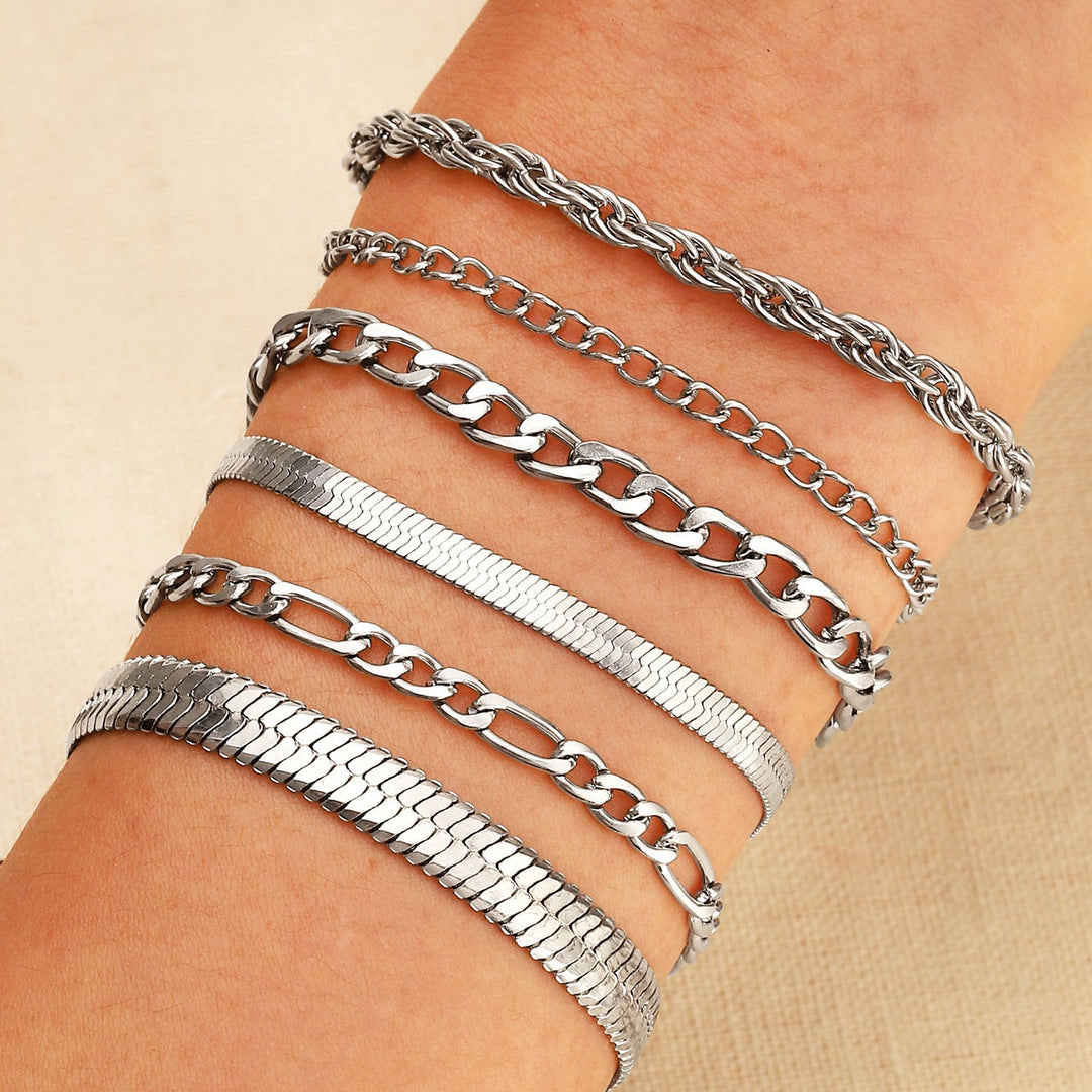 Multi-style gold chain bracelet set for women, featuring stackable designs. Versatile fashion accessory.