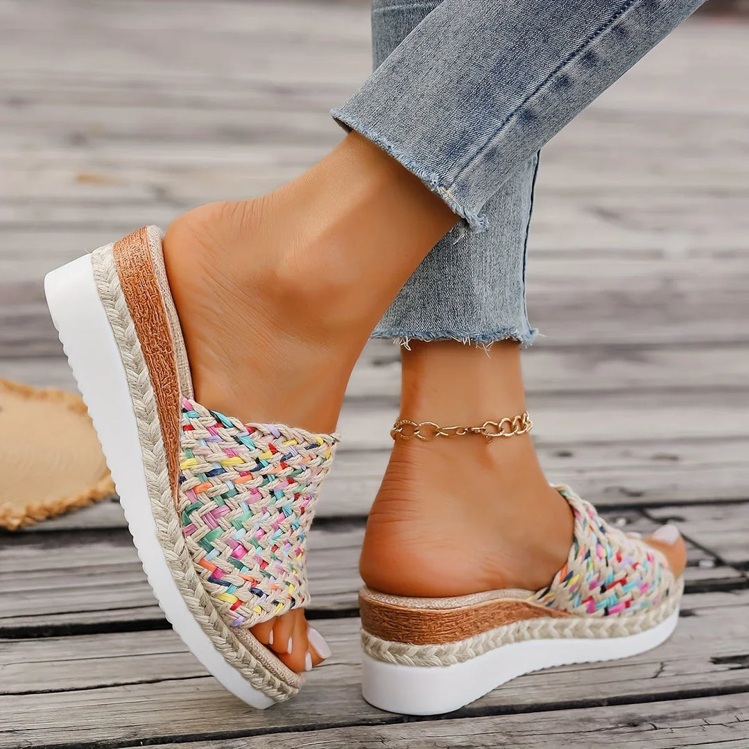 Elegant women's multicolor woven espadrille wedge sandals. Open-toe platform design, perfect for chic summer looks.