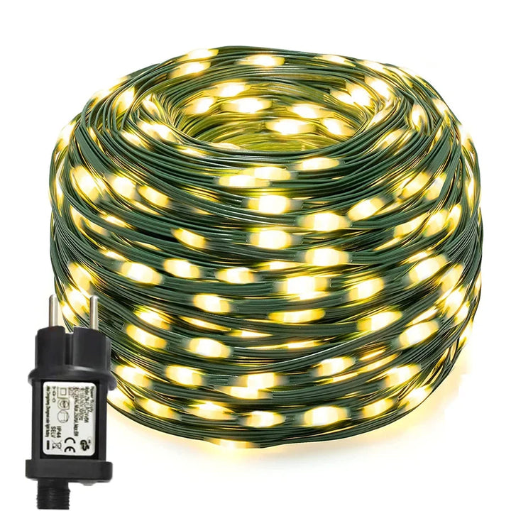 Warm white LED rope lights providing soft, decorative illumination for garden pathways & patio ambiance.