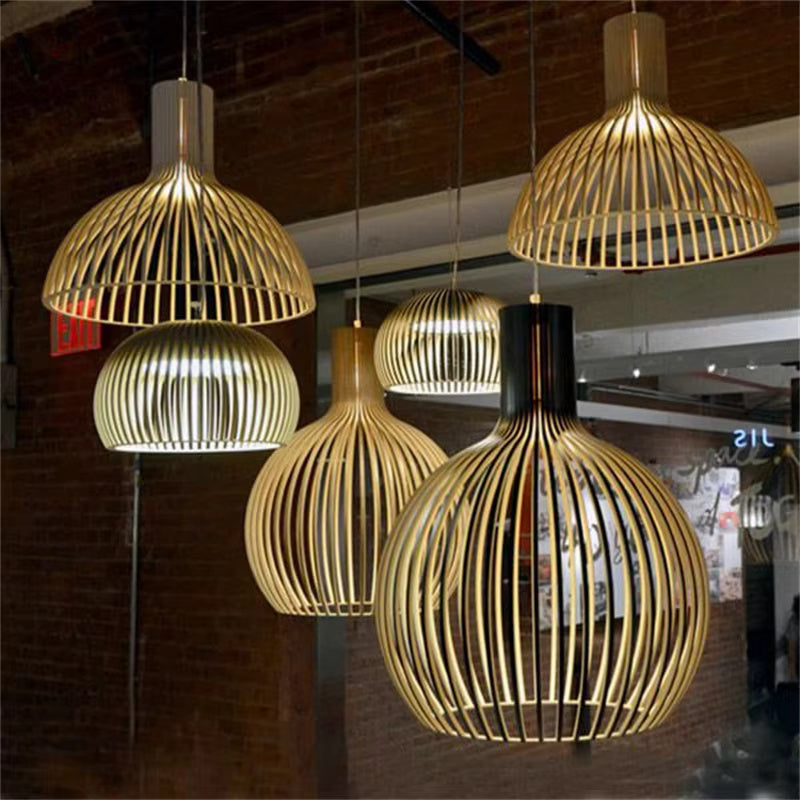 Modern organic wooden pendant lamp, Natura Orb, hanging in a cozy living room, providing warm, natural light.