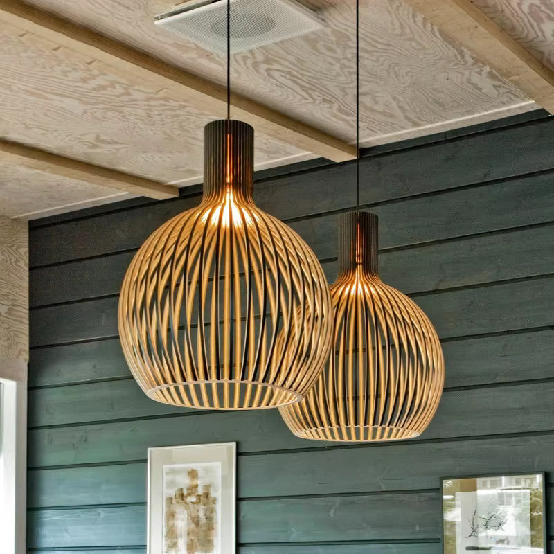 Stylish Natura Orb wooden pendant lamp, a natural decor element adding modern organic lighting to dining rooms.