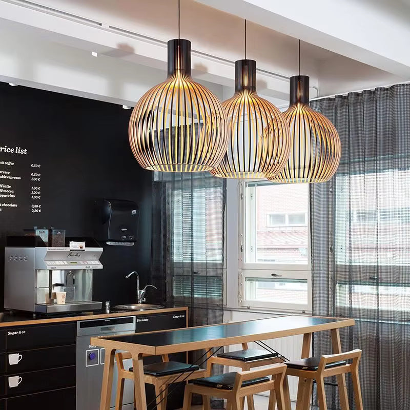 Close-up of Natura Orb organic wooden pendant lamp, showcasing its unique natural texture & modern design details.