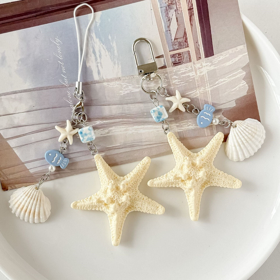 Nautical keychain with detailed shell and starfish charms, perfect ocean-themed accessory for keys.