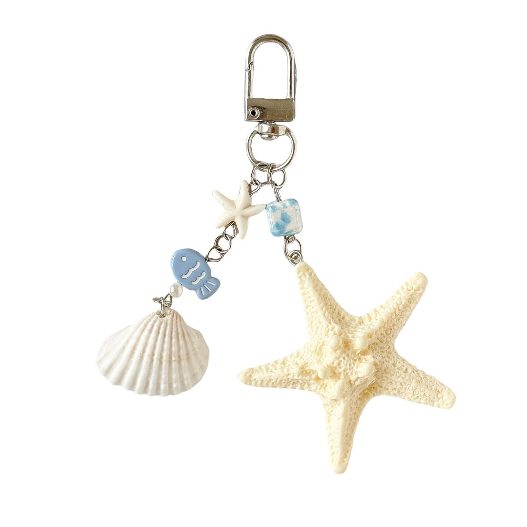 Stylish marine life keychain accessory showcasing intricate shell and starfish details for a nautical look.