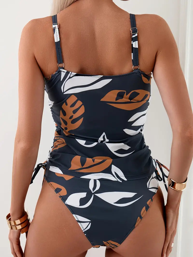 Stylish women's two-piece printed tankini set with adjustable ruched side ties, perfect for beach & holidays.