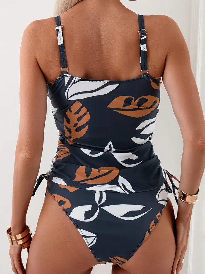 Stylish women's two-piece printed tankini set with adjustable ruched side ties, perfect for beach & holidays.