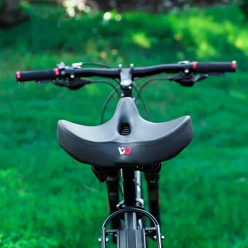 Comfortable wide bicycle saddle for maximum support and shock absorption, ideal for men and women cyclists.