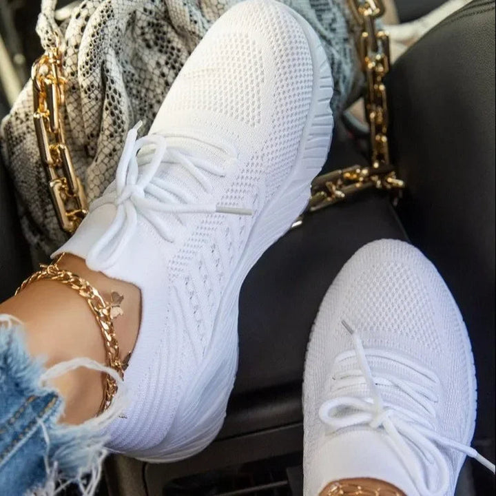 Stylish women's athletic sneakers, lightweight & breathable, ideal for walking, casual wear, and an active lifestyle.