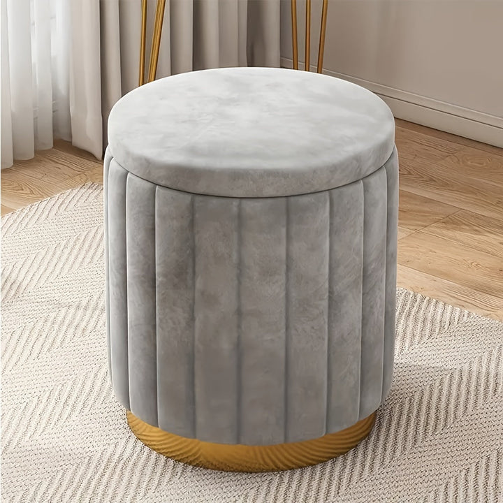 Chic round pouf with mirror finish, a Nordic storage ottoman enhancing any contemporary home interior.