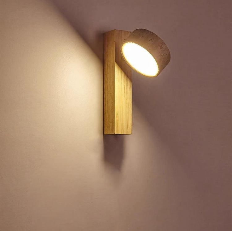 Off-white Wabi Sabi travertine LED wall lamp for minimalist home decor, providing soft ambient light.