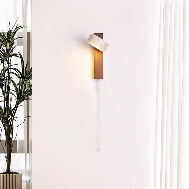 Textured Wabi Sabi off-white travertine LED wall sconce, enhancing home decor with natural beauty.