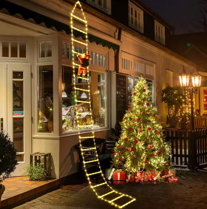 Outdoor Christmas climbing Santa Claus on a ladder, perfect for festive yard decoration & holiday display.