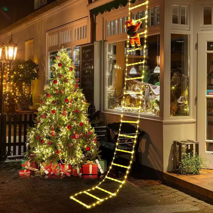 Whimsical outdoor Christmas climbing Santa on a ladder, ideal for festive holiday yard decor & displays.