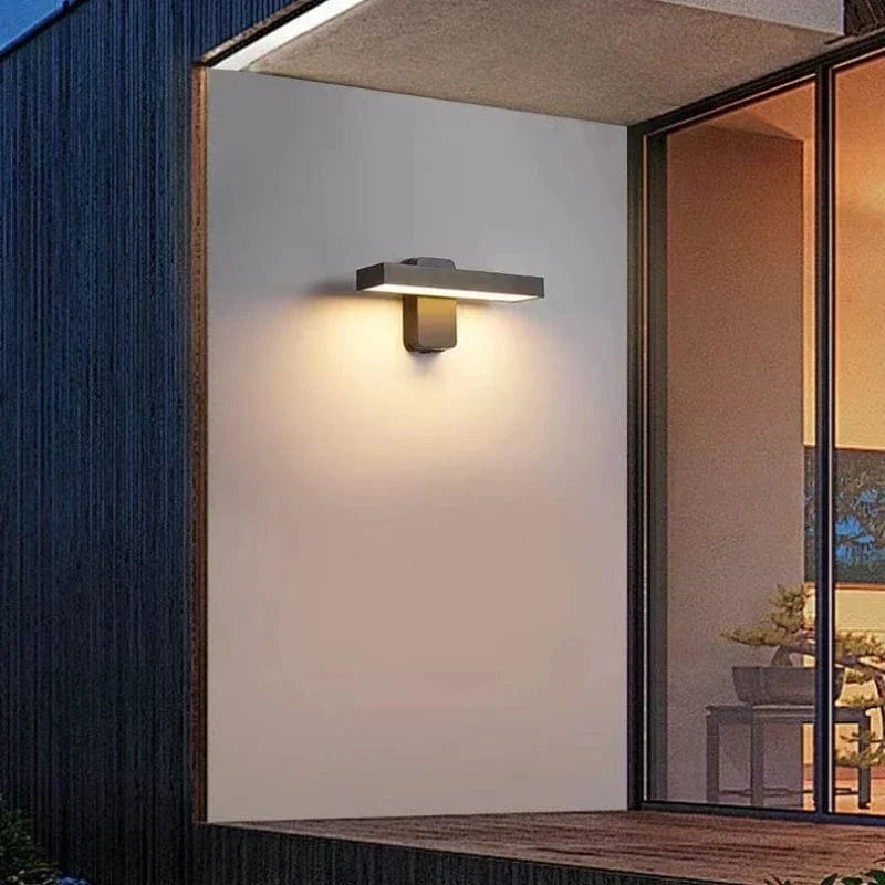 Residential outdoor motion sensor LED wall light, waterproof for safety.