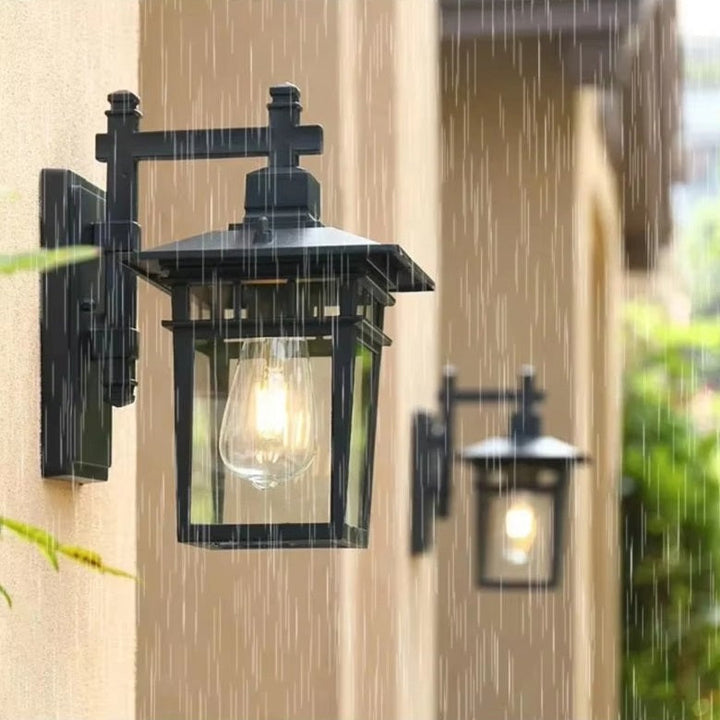 Durable black aluminum waterproof lantern wall light, a stylish & robust exterior garden fixture.