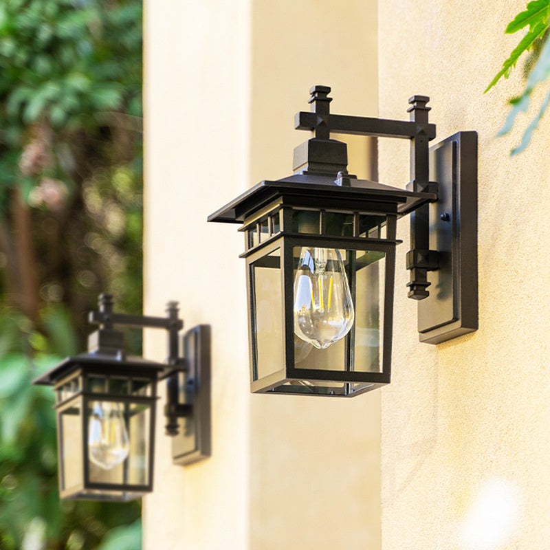 Side view of a modern black outdoor waterproof lantern wall light, suitable for any garden or patio.