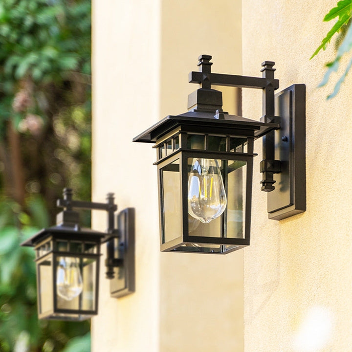 Side view of a modern black outdoor waterproof lantern wall light, suitable for any garden or patio.