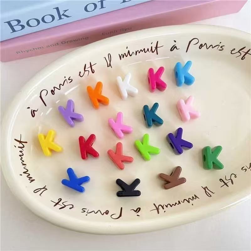 Custom 'X' initial keychain, vibrant alphabet charm for keys & backpacks.