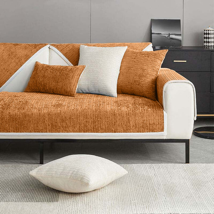 Soft striped chenille anti-scratch couch cover draped over a sofa, combining home decor and pet protection.