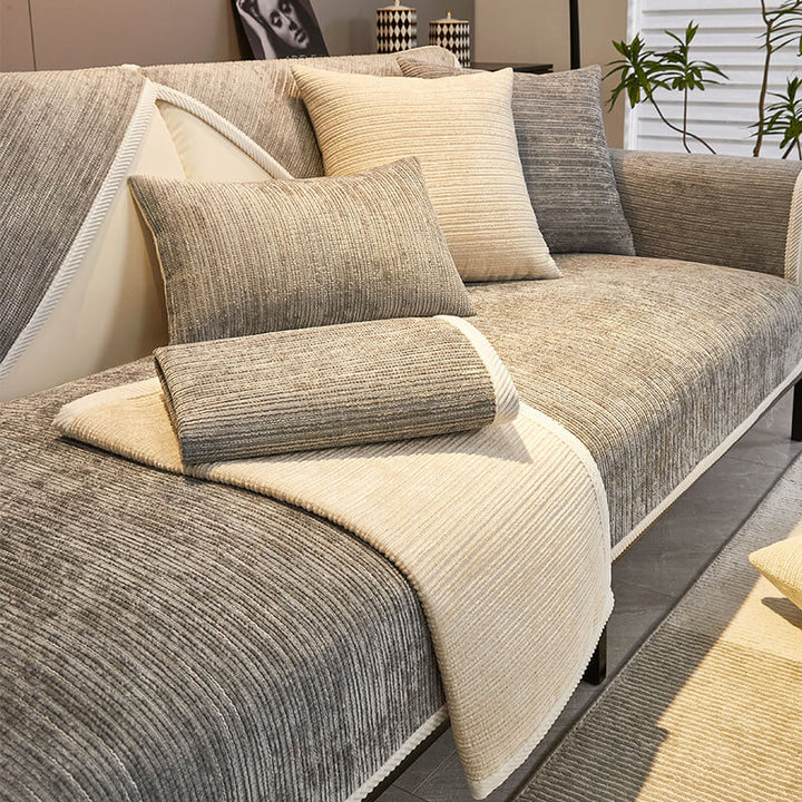 Elegant striped chenille couch cover in a cozy living room, providing anti-scratch protection and style.