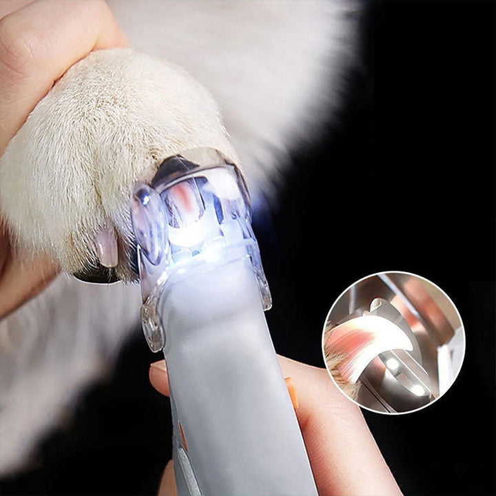 Pet nail clipper with bright LED light for safe and precise dog and cat paw grooming.