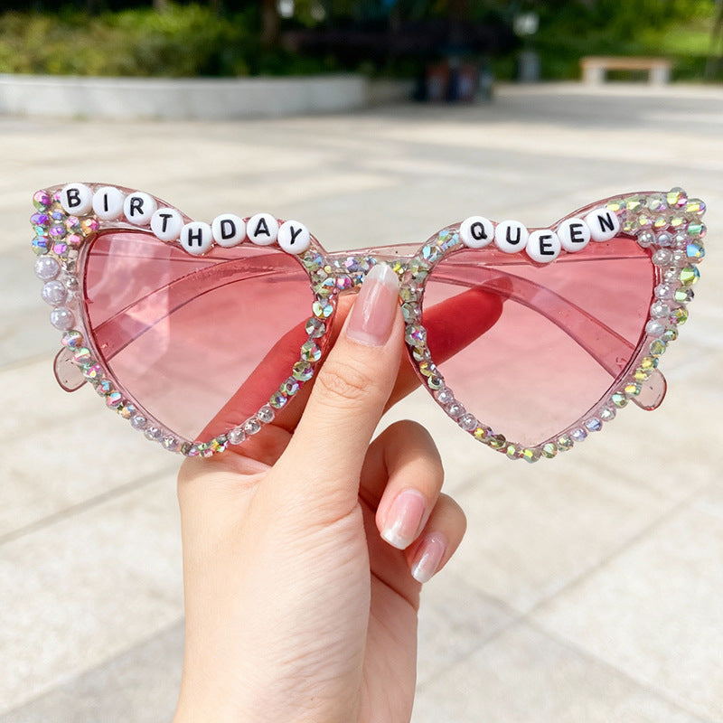 Pink heart-shaped rhinestone sunglasses for women, sparkling birthday party celebration accessory.