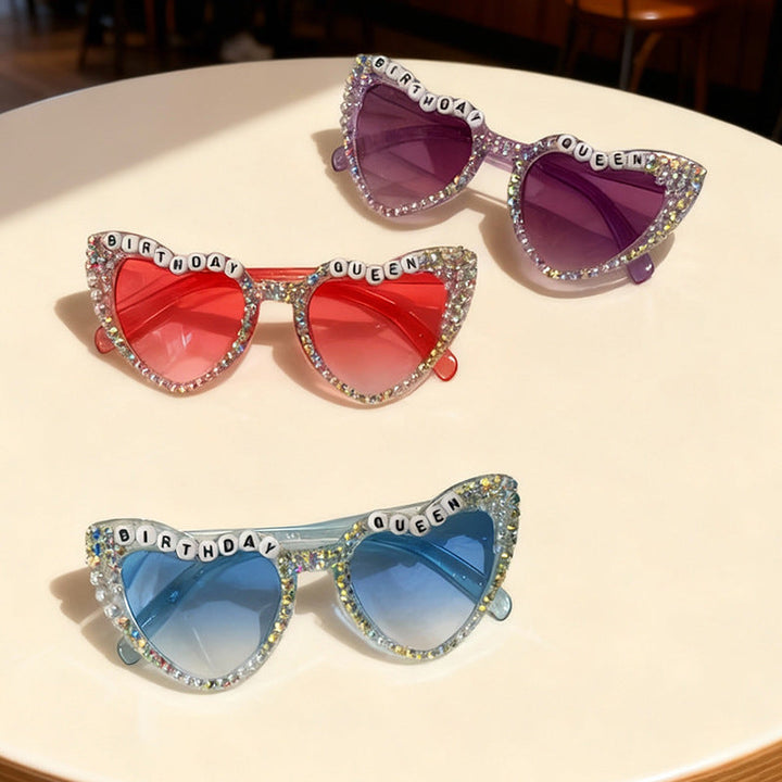 Sparkling sky blue heart-shaped women's sunglasses, festive and fun birthday celebration eyewear.