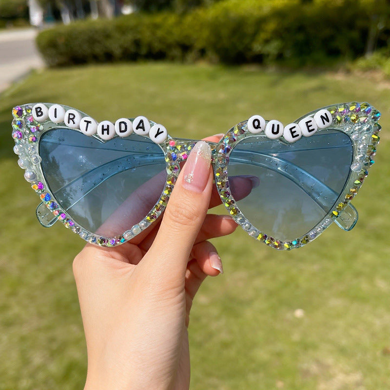 Festive pink heart sunglasses with dazzling rhinestones, perfect for a women's birthday celebration.