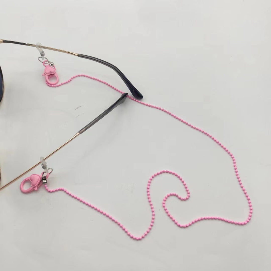 Pink phone chain holder for women. Stylish heart design phone strap, secure & hands-free.