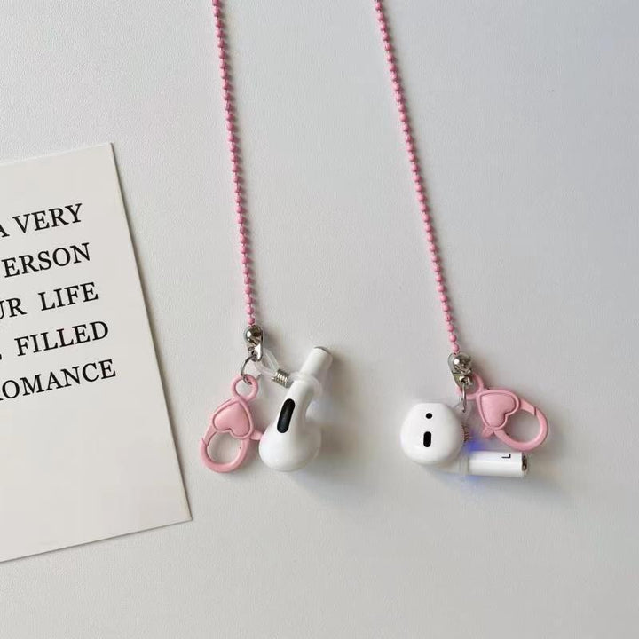 Stylish pink phone chain for women. Fashionable smartphone strap with heart design, secure & hands-free.