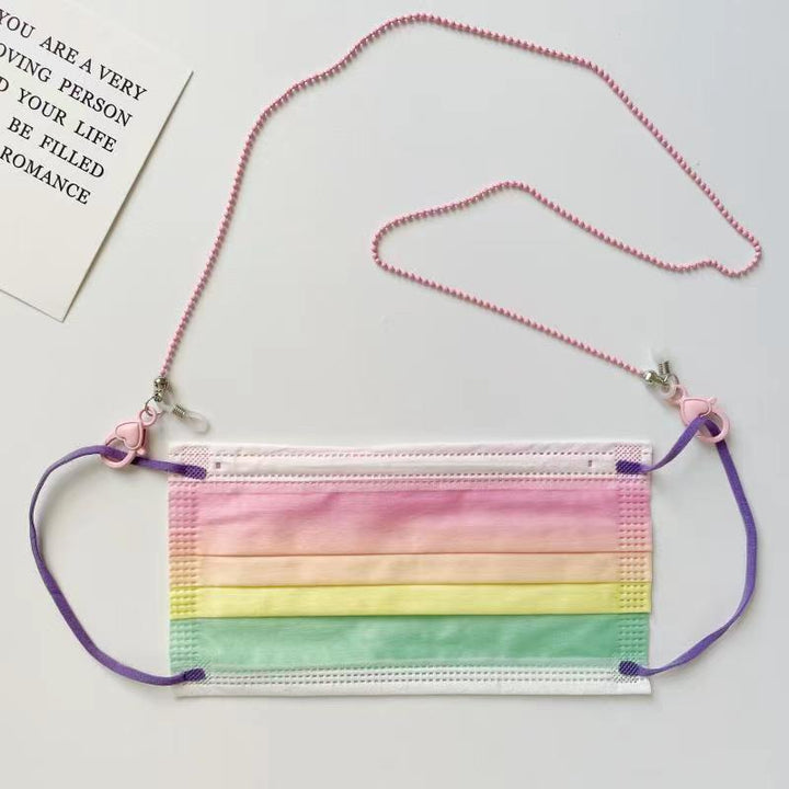 Pink heart design phone chain holder. Secure & stylish phone strap for women, offering hands-free convenience.