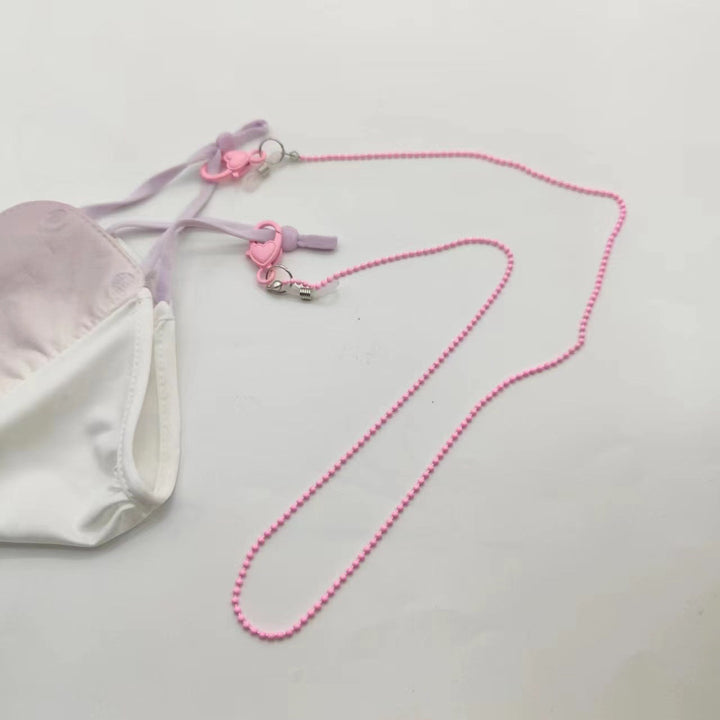 Elegant pink phone chain accessory. Durable phone holder strap for women, keeps phones secure & accessible.