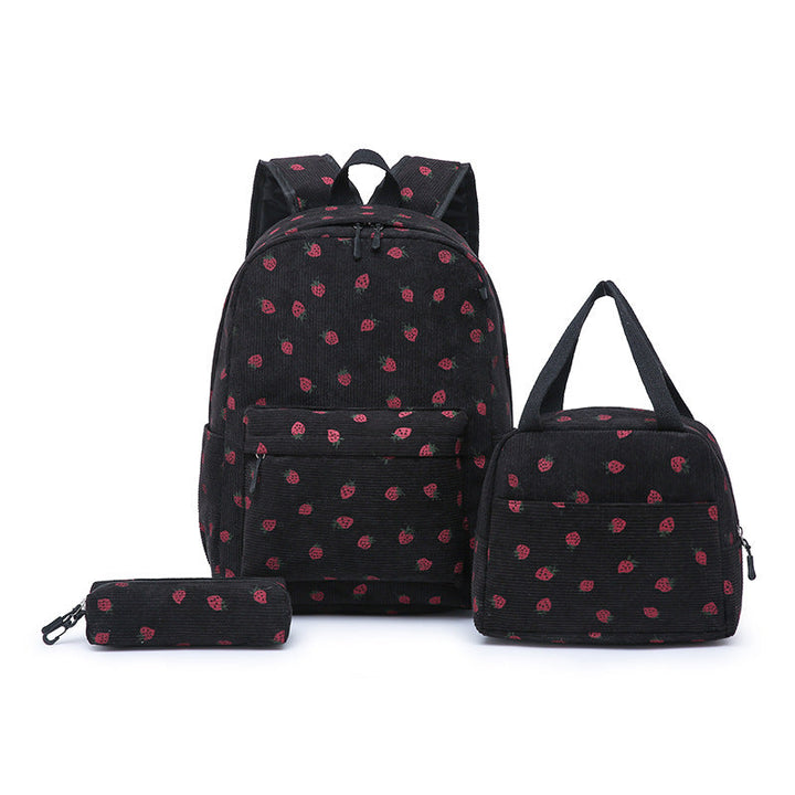 Spacious interior of a durable pink strawberry girls' backpack, showing compartments for school essentials.