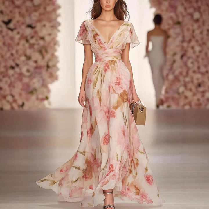 Pink women's flutter sleeve fit & flare maxi dress. Elegant A-line pullover perfect for summer vacation or casual events.