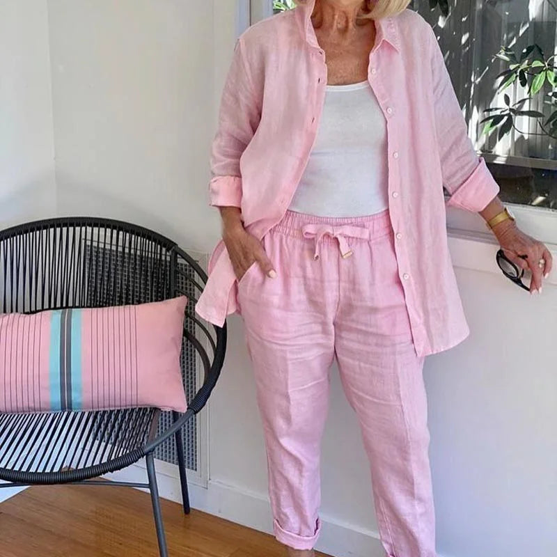 Pink women's relaxed fit denim jacket and drawstring pants set. Casual, comfortable spring/summer fashion.