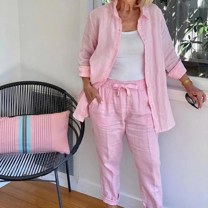Pink women's relaxed fit denim jacket and drawstring pants set. Casual, comfortable spring/summer fashion.
