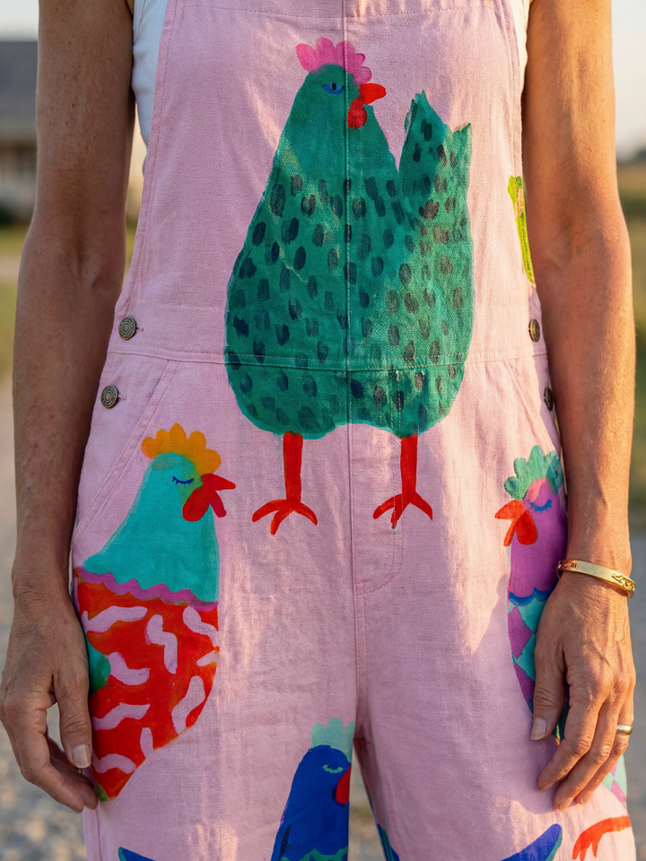 Full length women's jumpsuit, relaxed fit, featuring a fun hen motif print. Ideal for casual summer style.