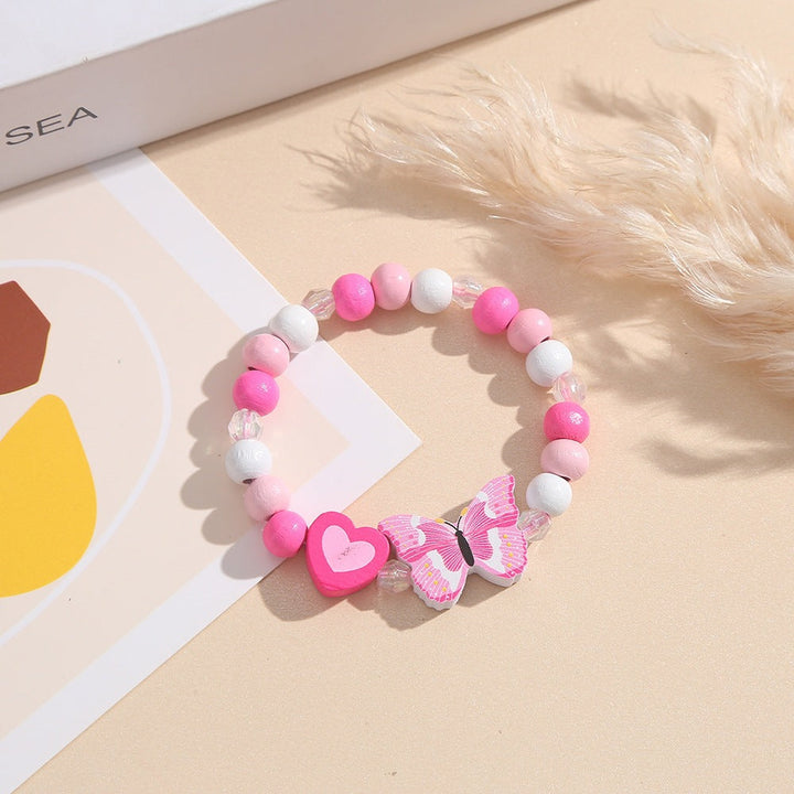 Stylish pink wooden bead bracelet, heart & butterfly charms, adds playful charm to women's/girls' outfits.